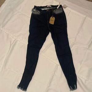Womens Stylish cut out Stretch Blue jeans with fringe bottoms